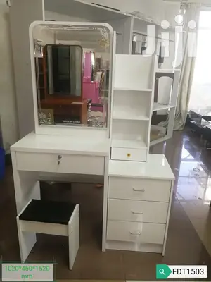 White Dresser With a Sliding Mirror