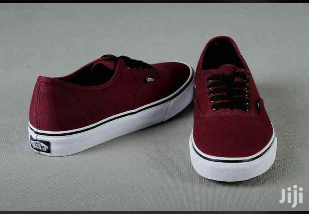 maroon vans with black sole