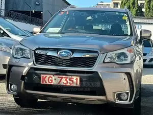 15 Subaru Forester in Gold offers all-wheel drive and a spacious interior. Test drive today!