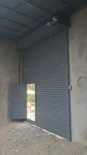 Roller Shutter Doors for Sale. Option of a Small Side Door.