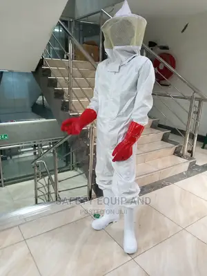 Honey Harvesting Overall With PVC Gloves and Smoker on Stock