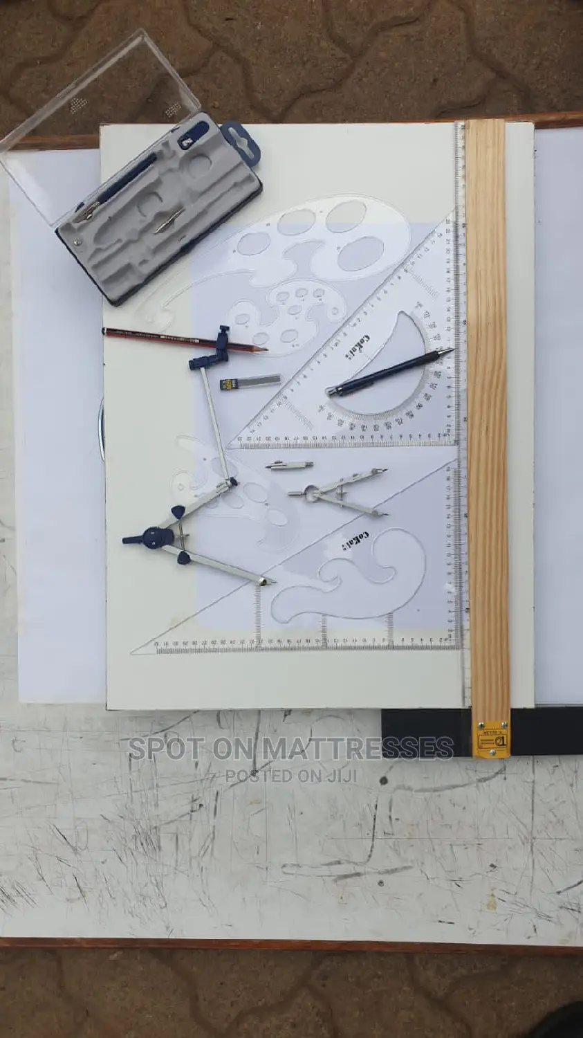 Drawing Set of Compasses on a Drawing Board