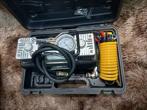 Air Compressor With Repair Puncture Tool