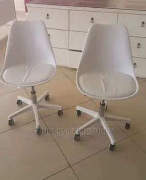 Padded Eames Chairs.