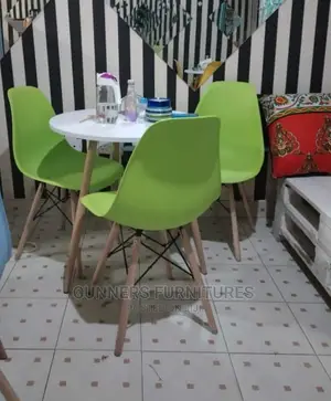 Eames Table and 3 Eames Chairs.