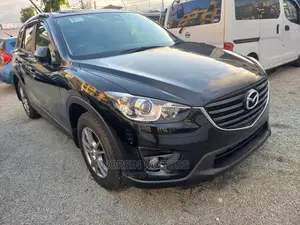 2015 Mazda CX-5 in Rich Burgundy: Modern Luxury SUV for Your Drive!