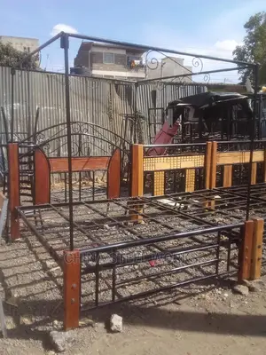Metalic Frame Mahogany Stand Bed