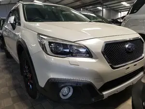 White 2015 Subaru Outback: Spacious SUV with 4WD Performance
