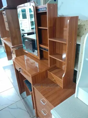 Brown Dresser With a Sliding Mirror