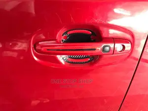 Red Car Fitted With Door Handle Antiscratch Stickers