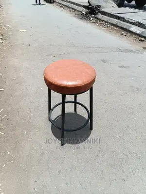 Backless Round Leather Stool.