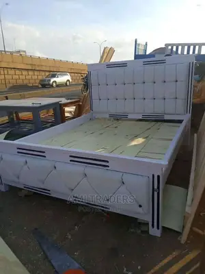 White Tuffed Bed