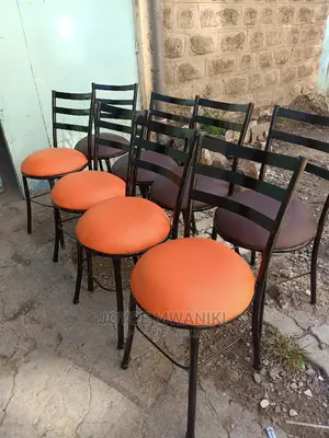 Flat Chairs for Restaurant Orange and Brown in Colour.