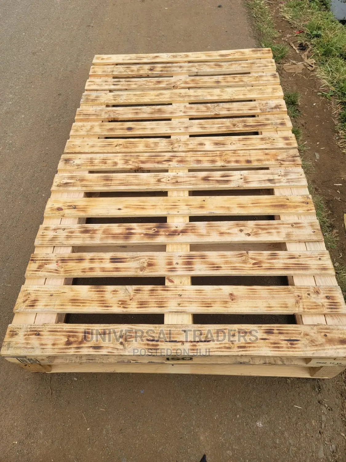 Torched Raised Wooden Pallet Bed