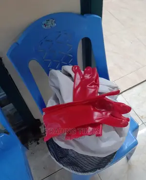 Bee Harvesting Gear With Red Rubber Gloves