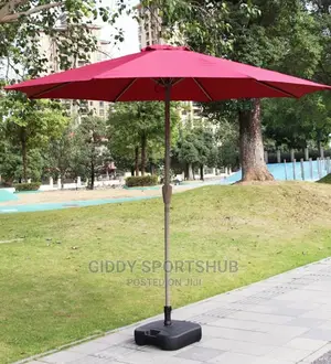 Folding an Outdoor Umbrella With an Iron Pipe
