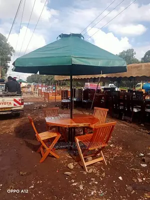 Outdoor Set With Foldable Chairs and an Umbrella