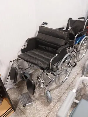 Extra Wide Wheelchair With Elevating Footrests.
