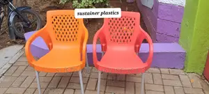 Red and Orange Plastic Chairs With Metal Tubing Legs