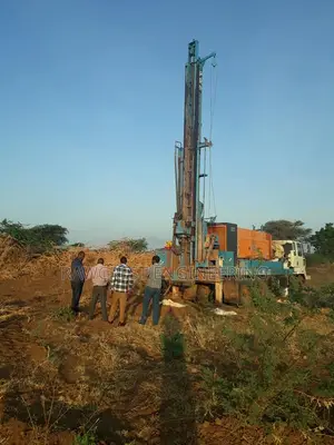 Water Drilling and Steel Tank Installation