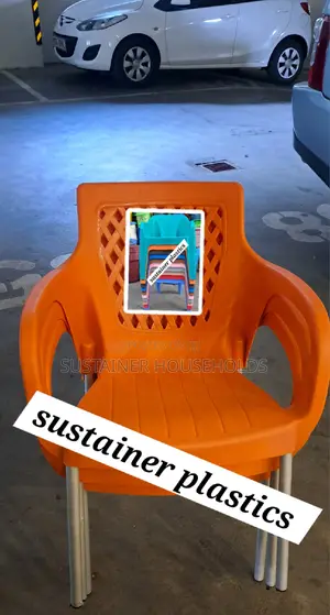 3 Orange Plastic Chairs With Armrest and Metal Legs