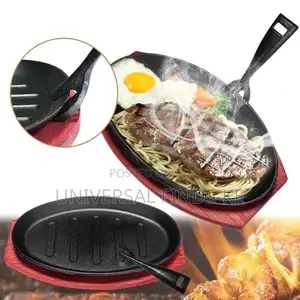 Sizzling Steak Platter With a Wooden Tray