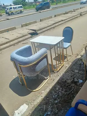 Manicure Set, Grey Seats and a Marble Table 