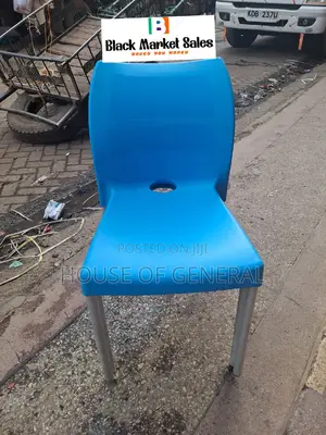 Armless Plastic Chair With Metal Tubing Legs