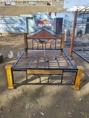 5 X 6 Metalic Bed With. Mahogany Stands