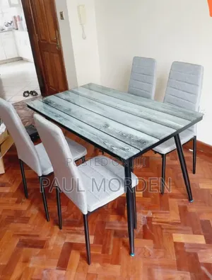 Rectangular Glass Top Dining Table With Four Dining Chairs