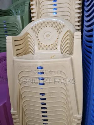 Cream Kenpoly Plastic Chairs With Arms.