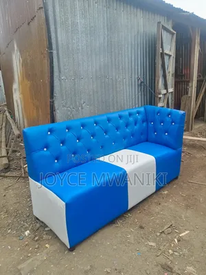 Couch Blue and White, With Armrest on Left Side.