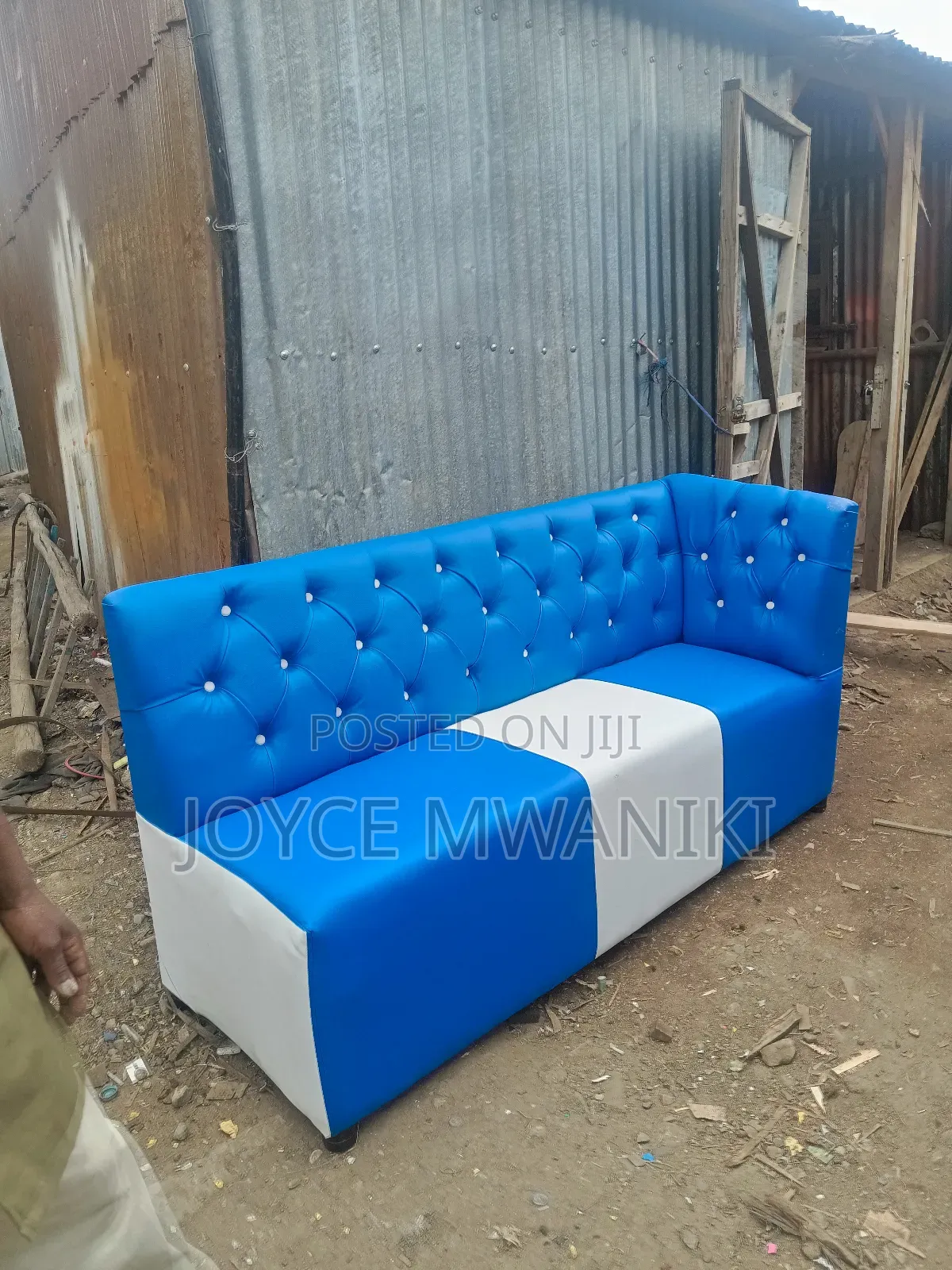 Couch Blue and White, With Armrest on Left Side.