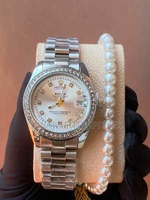 Silver Rolex Watch With Pearl Bracelet