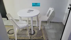 2 Armless Plastic Chairs With a Complast Plastic Table Set