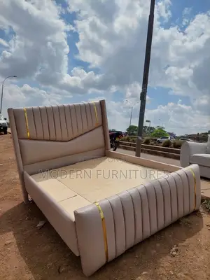 Cream Upholstery Tufted King Bed With Wingback Headboard
