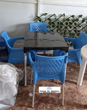 4 Blue Plastic Chair And1 Plastic Table With Metal Legs