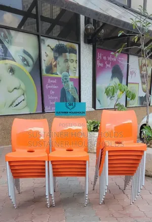 Plastic Chairs Of Metal Tubing Legs In Orange