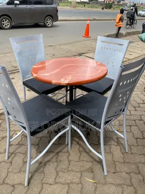 Brown Round Table and Restaurant and Bar Chairs