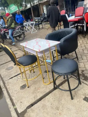 Black Manicure Chairs and Manicure Marble Pink Table
