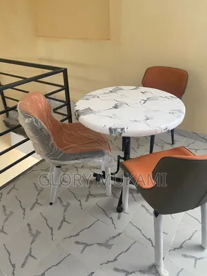 Restaurants Chairs and Round Marble Table