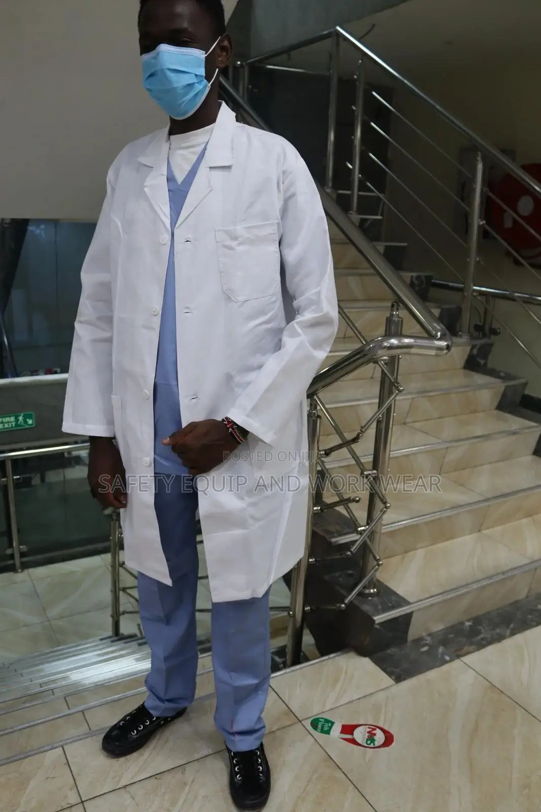 Sky Blue Medical Scrub With A Lab Coat