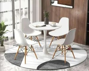 White Round Dining Table With Four Dining Chairs