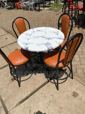White Round Marble Table and Chairs