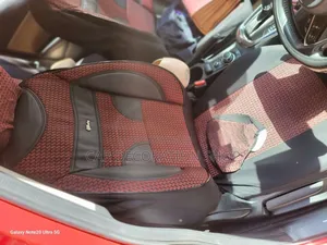 Car Fitted With Maroon Fabric Seat Cover With Leather Patch
