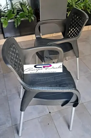 2pcs Black Plastic Chairs With Metal Tubing Legs.