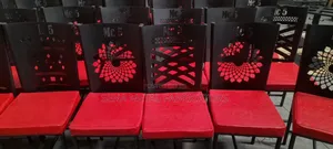 Assorted Restaurant Chairs With Laser-Cut Designs.