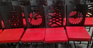 Assorted Restaurant Chairs With Laser-Cut Designs.