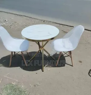 Round Table With Goldish Stand Plus Eames Chair
