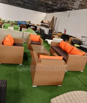 Brown 7 Seater Landscape Sofaset With Orange Cushions